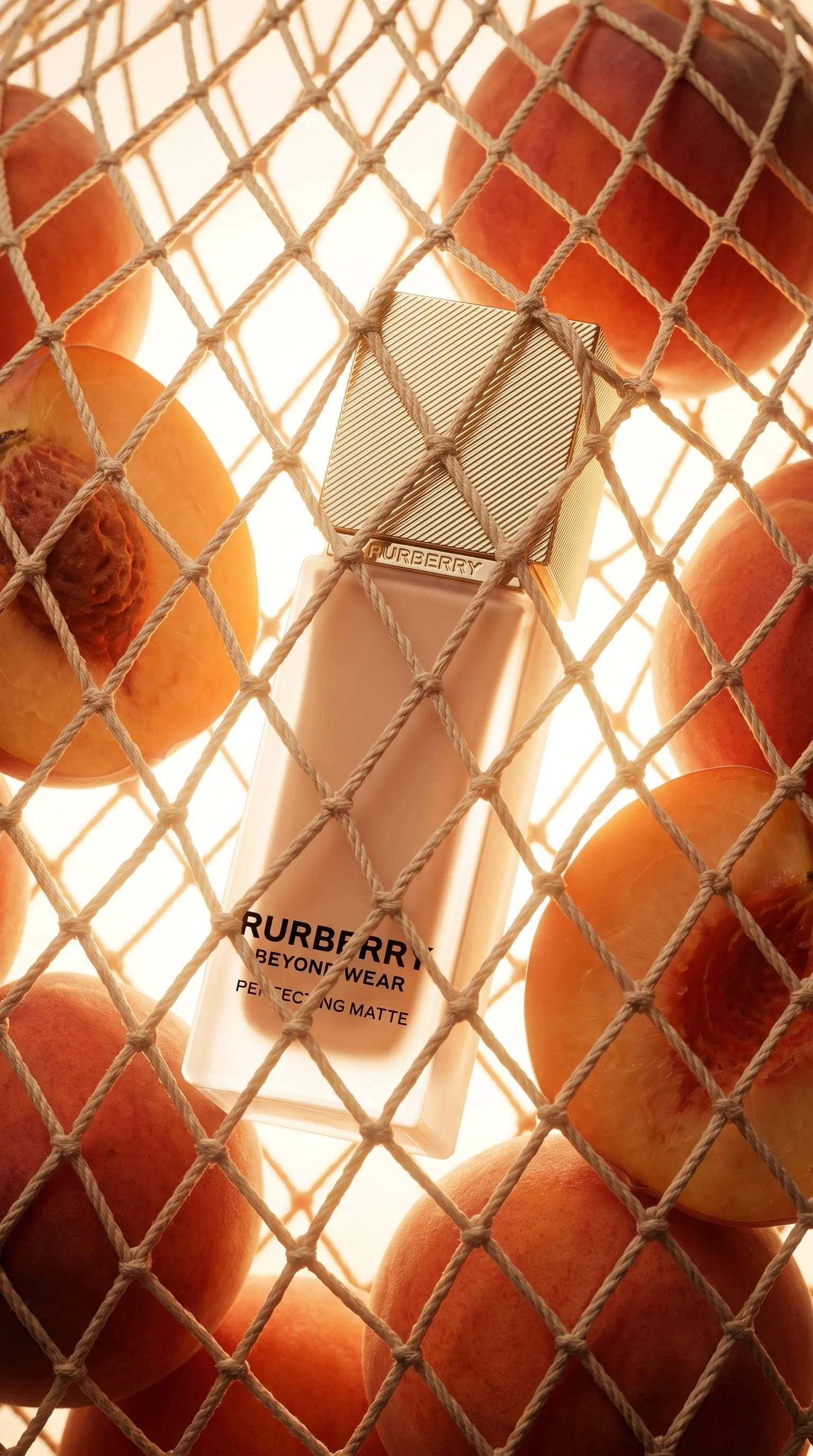 Foundation bottle among peaches — product reference